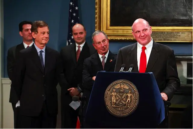Deputy Mayor Stephen Goldsmith and Mayor Bloomberg look at Microsoft CEO Steve Ballmer at yesterday's press conference